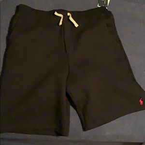 Black sweatshorts with red pony